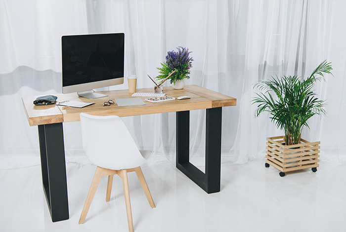 A small desk with a home computer setup.